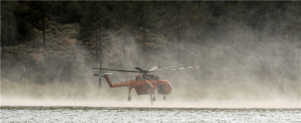 Firefighters hold line against California wildfire