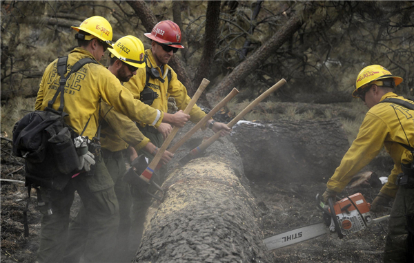 Firefighters hold line against California wildfire