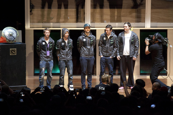 (L-R) Members of 'The Alliance' Joakim Akterhall, Jerry Lundqvist, Jonathan Berg, Gustav Magnusson, and Henrik Ahnberg stand next next to the champion's shield during 'The International' Dota 2 video game competition in Seattle, Washington August 11, 2013. Gamers storm Seattle for Dota 2 competition