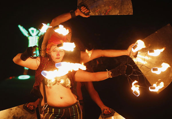 Members of Northwest Fire Conclave perform before the Man burns during the Burning Man 2013 arts and music festival in the Black Rock Desert of Nevada, Aug 31, 2013. Burning Man arts and music festival in Nevada