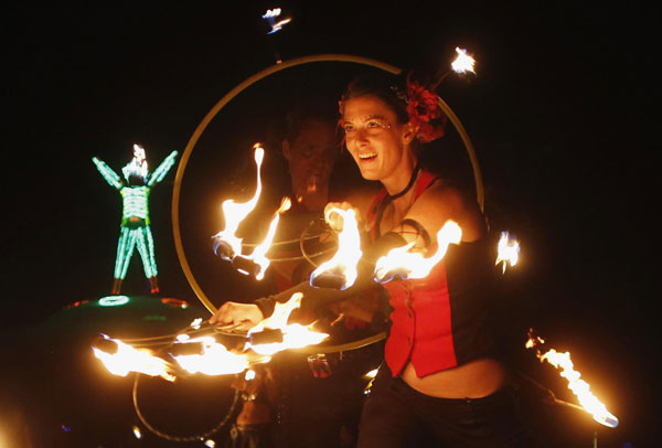 Members of Northwest Fire Conclave perform before the Man burns during the Burning Man 2013 arts and music festival in the Black Rock Desert of Nevada, Aug 31, 2013. Burning Man arts and music festival in Nevada