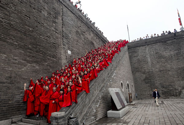 Couples in traditional Han Dynasty costumes wed at a ceremony based on ancient tradition in Xi’an on May 1, 2012. Couples wed in ancient style