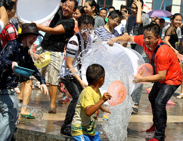 Participants in the annual water festival in Kaili, Guizhou province, enjoy splashing each other on Wednesday. Water Festival in SW China