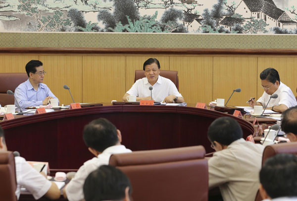 Liu Yunshan (C), a member of the Standing Committee of the Political Bureau of the Communist Party of China (CPC) Central Committee, addresses a symposium of the 'mass line' educational campaign of the CPCCentral Committee, in Beijing, Aug 26, 2013. 'Mass line' should not be conducted perfunctorily