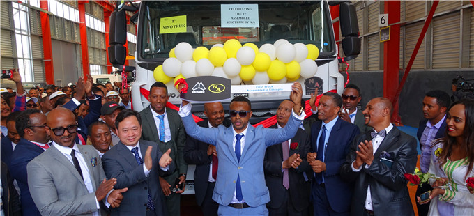Executives cheer the first truck in Ethiopia