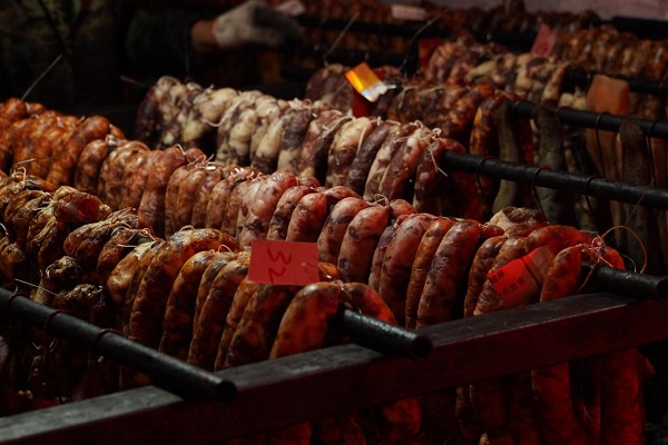 Time-honored festive meat curing continues in metropolis