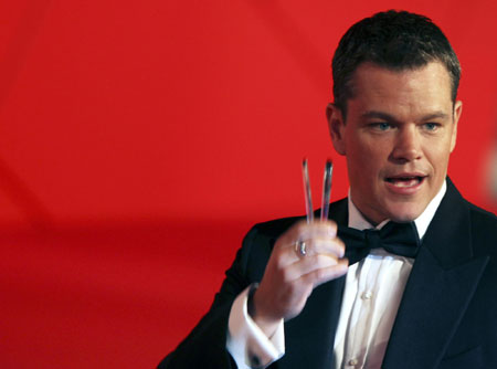 Matt Damon and his wife walk on the red carpet at the 66th Venice Film Festival