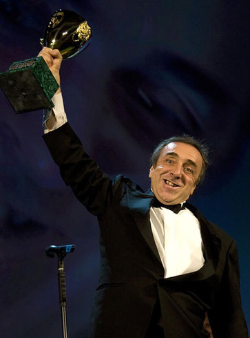 Orlando holds Coppa Volpi trophy for Best Actor at Venice