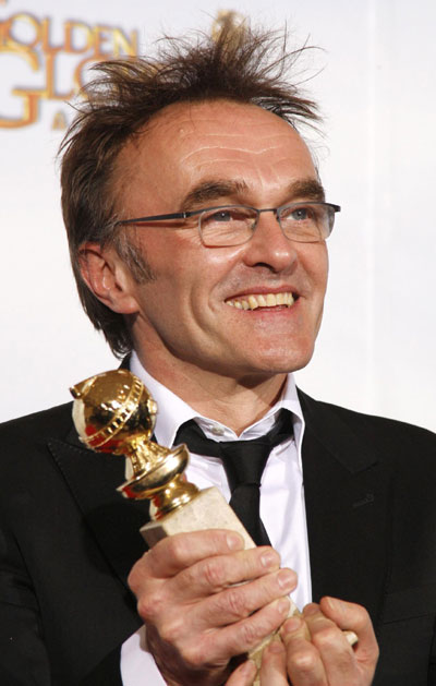 Danny Boyle holds his award for Best Director at Golden Globe