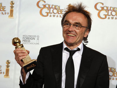 Danny Boyle holds his award for Best Director at Golden Globe