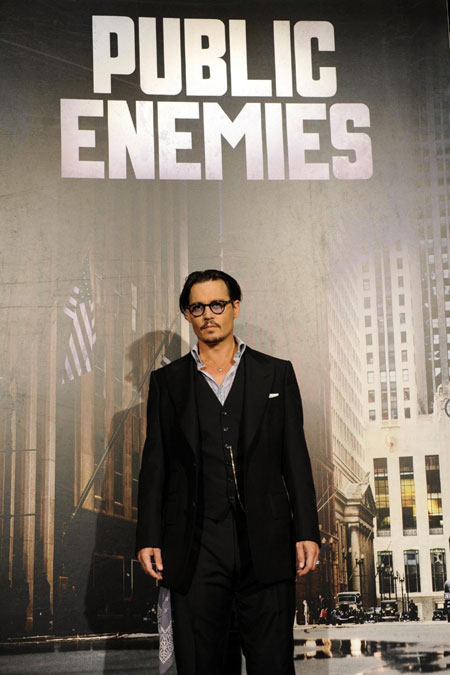 Cast members Depp,Cotillard and director Mann pose at premiere of