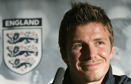England captain David Beckham smiles during a news conference at Manchester United's Old Trafford stadium in Manchester, northern England June 2, 2006. 