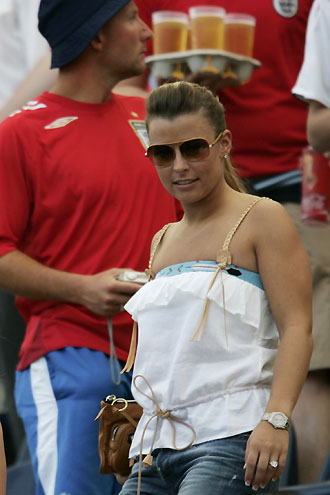 Wayne Rooney's fiancee Coleen McLoughlin waits in the stands before the start of the Group B World Cup 2006 soccer match between England and Paraguay in Frankfurt June 10, 2006. [Reuters]