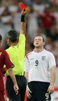 Referee Horacio Elizondo of Argentina shows England's Wayne Rooney a red card during their World Cup 2006 quarter-final soccer match against Portugal in Gelsenkirchen July 1, 2006.