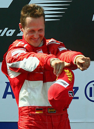 Germany's Ferrari Formula One driver Michael Schumacher celebrates on the podium after winning the French Grand Prix at the Magny Cours circuit July 16, 2006.