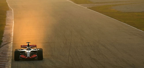 British Formula One driver Lewis Hamilton drives his McLaren car during a training session at Catalunya's racetrack in Montmelo, near Barcelona, November 29, 2006. 