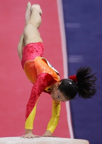 Chinese add three golds to double haul at gymnastics worlds