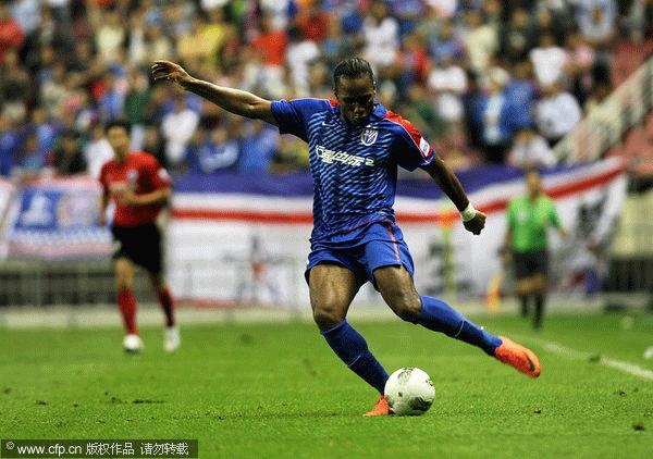 Drogba plays for Shanghai Shenhua in the Chinese Super League games in Shanghai, Sept 15, 2012 file photo. Shanghai Shenhua shocked by Drogba transfer