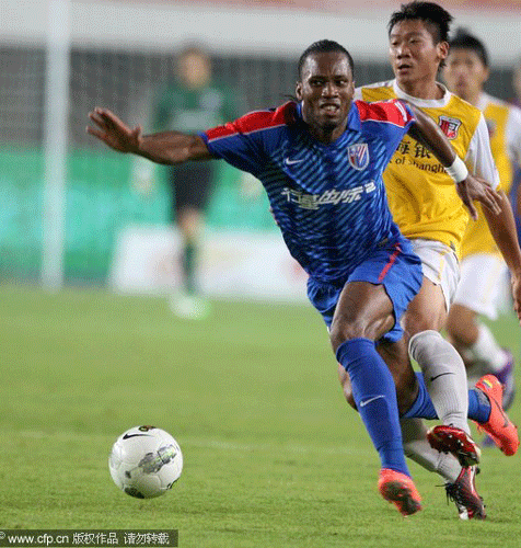 Drogba plays for Shanghai Shenhua in the Chinese Super League games in Shanghai, Sept 22, 2012 file photo. Shanghai Shenhua shocked by Drogba transfer