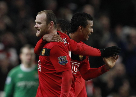 Rooney sends United through, dashes City dream