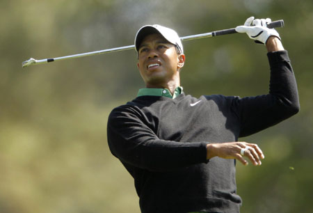 Woods tames course as charm offensive continues