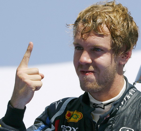 Red Bull Formula One driver Sebastian Vettel of Germany celebrates after winning the European F1 Grand Prix in Valencia June 26, 2011. Vettel claims not to know his F1 championship lead