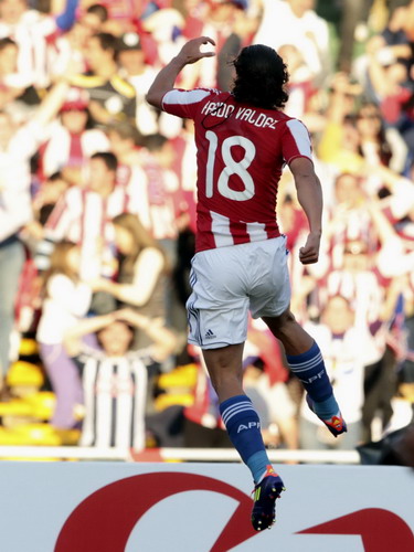 Paraguay's Nelson Haedo Valdez celebrates after scoring during their match against Brazil in the first round of the Copa America soccer tournament in Cordoba, July 9, 2011. Brazil draws Paraguay 2-2 in Copa America