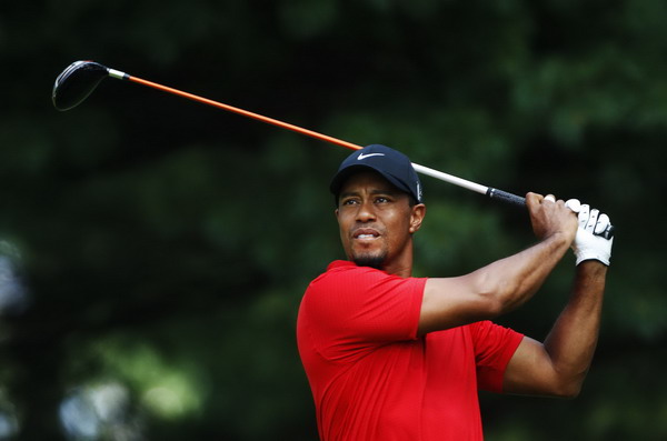 Tiger Woods of the US tees off on the second hole during the final round of the WGC Bridgestone Invitational PGA golf tournament at Firestone Country Club in Akron, Ohio, August 7, 2011 Still acting like the old Tiger in a new world