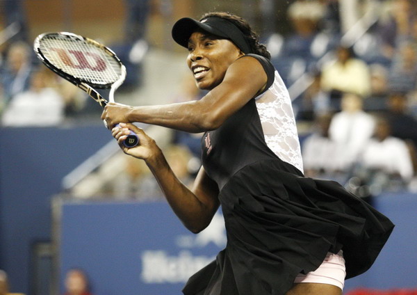 Venus Williams of the US, wearing a lace-backed tennis dress, hits a return to Vesna Dolonts of Russia during their match at the US Open tennis tournament in New York, Aug 29, 2011. Federer, Venus roll on, Kvitova out in US Open