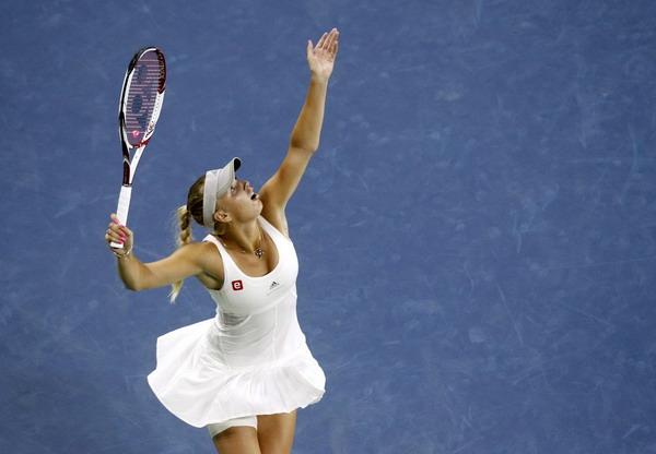 Caroline Wozniacki of Denmark returns volley to Arantxa Rus of the Netherlands during their match at the US Open tennis tournament in New York Sept 1, 2011. Top seed Wozniacki surges into 3rd round at US Open
