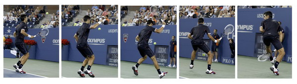 Novak Djokovic of Serbia returns a shot between his legs to Carlos Berlocq of Argentina during their match at the US Open tennis tournament in New York Sept 1, 2011. Djokovic romps past Berlocq in US Open 2nd round