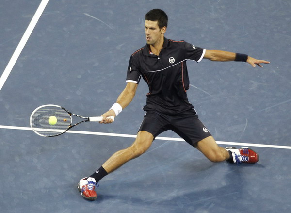 Novak Djokovic of Serbia returns a forehand to Carlos Berlocq of Argentina during their match at the US Open tennis tournament in New York Sept 1, 2011. Djokovic romps past Berlocq in US Open 2nd round