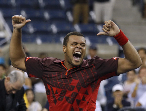 Jo-Wilfried Tsonga of France celebrates after defeating Mardy Fish of the US in five sets in their match at the US Open tennis tournament in New York, Sept 5, 2011. Tsonga rallies past Fish to make US Open quarters