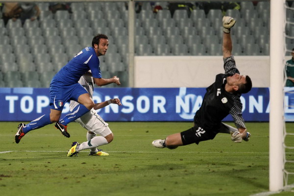 Giampaolo Pazzini (L) scores against Slovenia during their Euro 2012 qualifying soccer match at the Artemio Franchi stadium in Florence Sept 6, 2011. Italy qualify for Euro 2012 with win over Slovenia