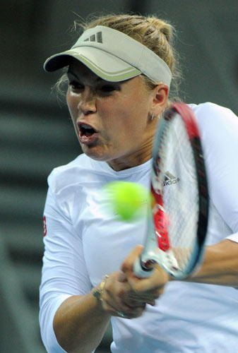 After French Open winner Chinese Li Na and Wimbledon champion Czech Petra Kvitova suffered quick exits in Beijing, newly-crowned US Open winner Samantha Stosur of Australia was upset by Russia's Maria Kirilenko 7-5, 1-6, 7-5. Slam winners hit wall in Beijing