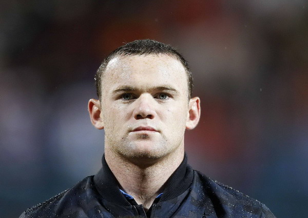 England's Wayne Rooney watches ahead of their Euro 2012 Group G qualifying soccer match against Montenegro in Podgorica Oct 7, 2011. Rooney's England place in jeopardy after red card