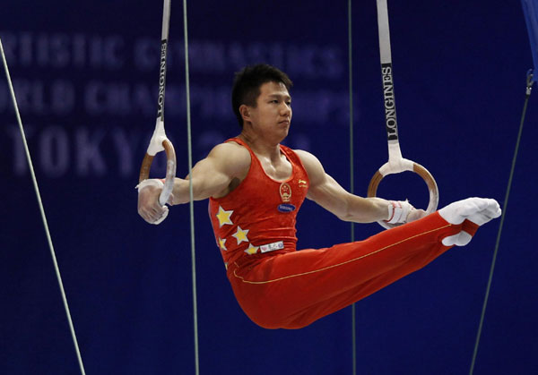 China's Chen Yibing competes on the rings during the men's apparatus final at the Artistic Gymnastics World Championships in Tokyo October 15, 2011. Chen wins rings title at gymnastics worlds