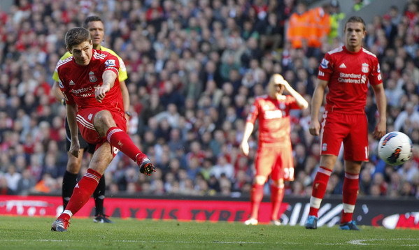 Liverpool's Steven Gerrard shoots and scores during their English Premier League soccer match against Manchester United at Anfield in Liverpool, northern England Oct 15, 2011. United, Liverpool share points and jibes