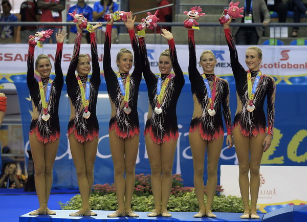 Canada's team celebrates their silver medal in the rhythmic gymnastics group general qualification round at the Pan American Games in Guadalajara Oct 16, 2011. Gymnasts compete at Pan American Games