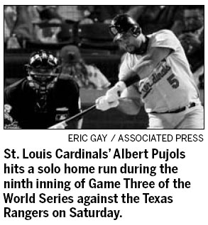 Pujols smashes way into record books