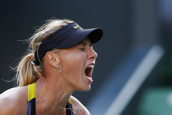 Maria Sharapova of Russia reacts after scoring a point against Julia Goerges of Germany during their match at the Pan Pacific Open tennis tournament in Tokyo Sept 28, 2011. Top spot not a priority for revitalised Sharapova