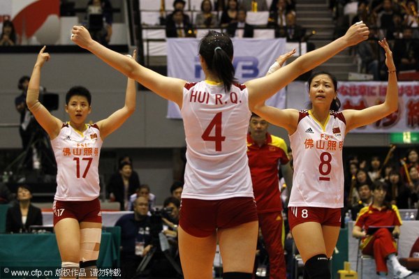Chinese volleyball players Zhang Lei (17), Hui Ruoqi (4) and Wei Qiuyue react during the match against hosts Japan in Hiroshima, Nov 6, 2011. China beats Japan at women's volleyball world cup