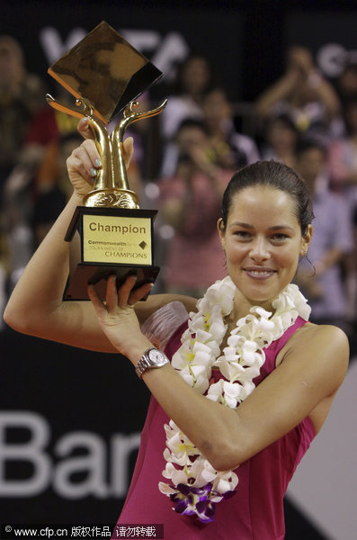 Ana Ivanovic of Serbia holds her champion trophy at the award ceremony after defeating Anabel Medina Garrigues of Spain in their Bali Tournament of Champions tennis final match in Nusa Dua, Bali, Indonesia, Nov 6, 2011. Ivanovic celebrates birthday with Bali high