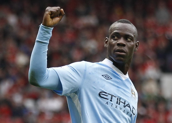 Manchester City's Mario Balotelli celebrates after scoring against Manchester United during their English Premier League soccer match at Old Trafford in Manchester, northern England, Oct 23, 2011. I am not mad and don't miss Serie A - Balotelli