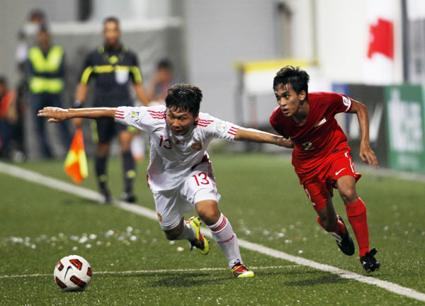 Former Asian champion Iraq's two goals ended China's slim hopes of advancing despite a crushing 4-0 away win over Singapore in the fifth round of the World Cup Asian zone qualifiers on Tuesday. China bids farewell to world cup despite a 4-0 win