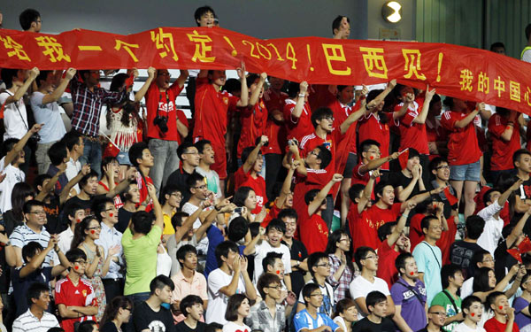 Former Asian champion Iraq's two goals ended China's slim hopes of advancing despite a crushing 4-0 away win over Singapore in the fifth round of the World Cup Asian zone qualifiers on Tuesday. China bids farewell to world cup despite a 4-0 win