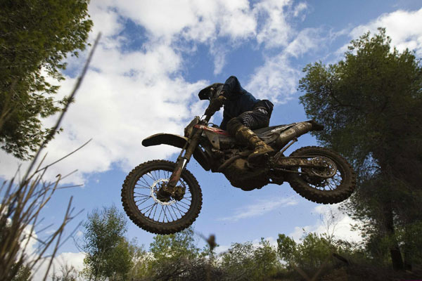A motocross rider competes during the Israel's Enduro Championship 2012 near Kibbutz Negba in southern Israel. Enduro Championship 2012