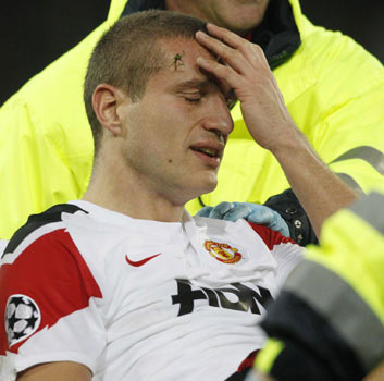 Sir Alex Ferguson's disappointment was compounded by a knee injury sustained by captain Nemanja Vidic that saw him stretchered off shortly before halftime. Vidic injury adds to misery