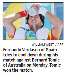 Players swathed themselves in ice packs, one felt ill and another complained she couldn't breathe on Monday as soaring heat made for a gruelling first day at the Australian Open. Ice, cameras, action under the sun