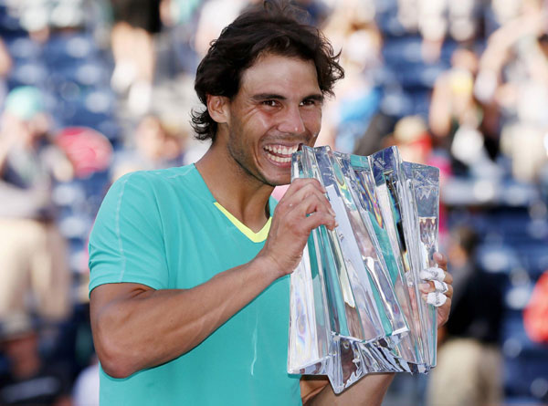 Rafael Nadal of Spain poses with his trophy after he defeated Juan Martin Del Potro of Argentina in the men's singles final match to win the BNP Paribas Open ATP tennis tournament in Indian Wells, California, March 17, 2013. Comeback maestro Nadal wins third Indian Wells title